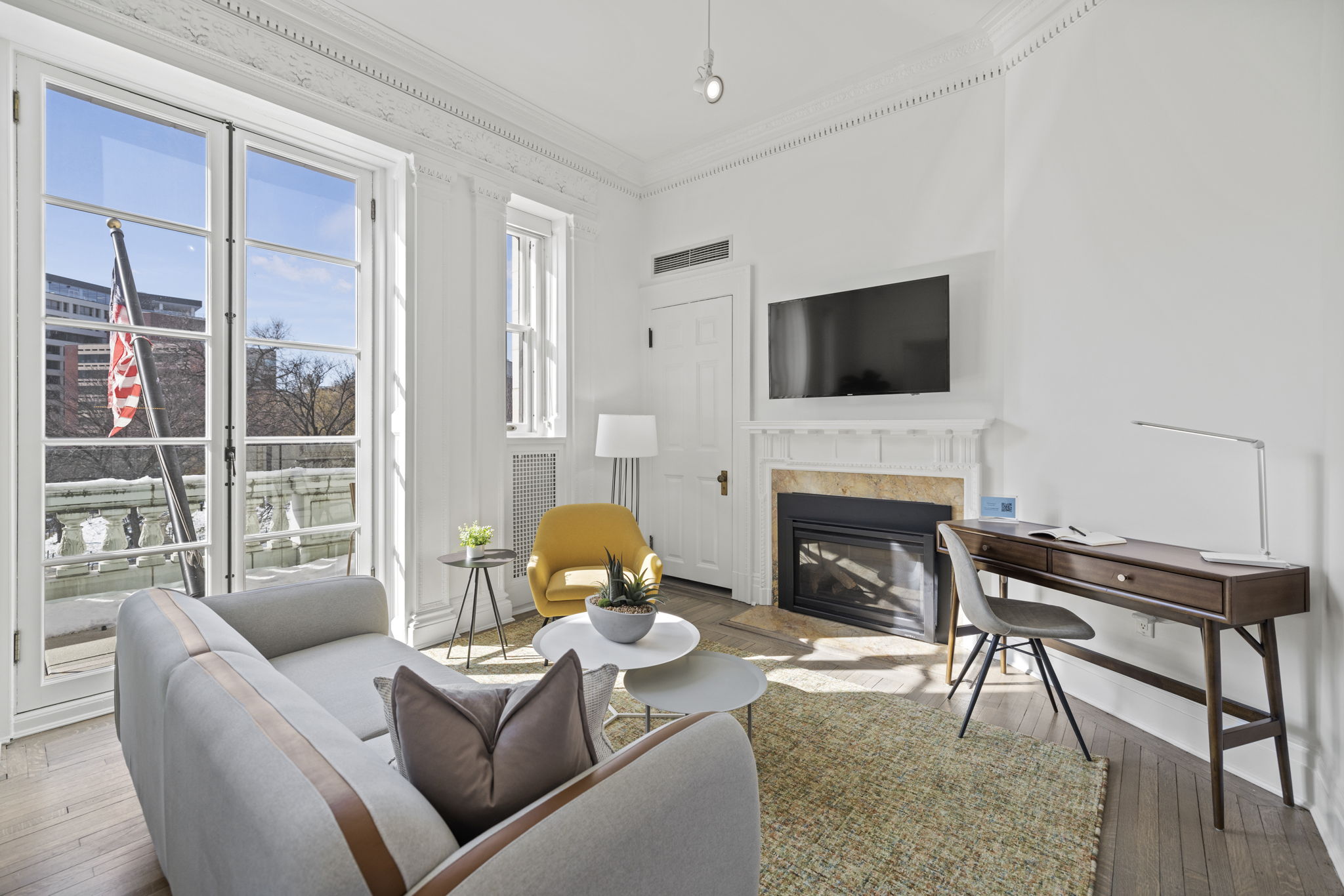 Modern guest suite at Placemakr Dupont Circle with a spacious layout, chef-ready kitchen, and comfortable living area.