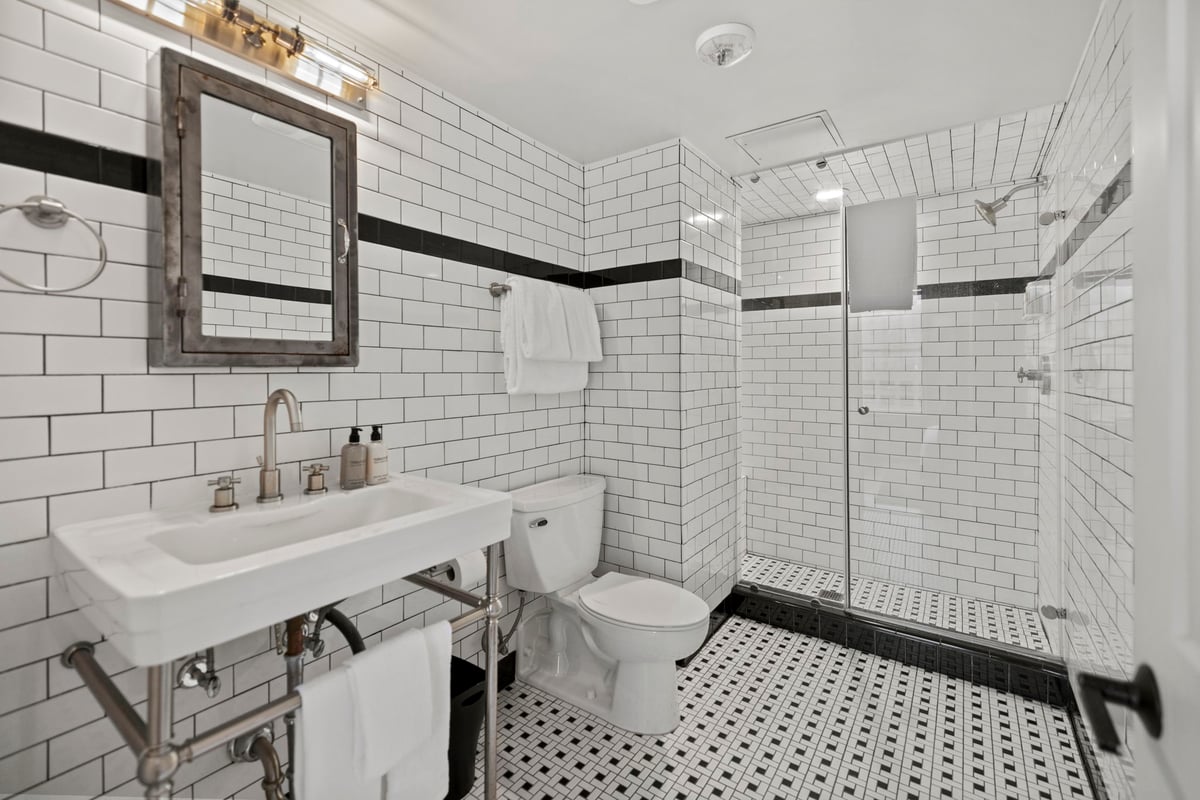Bathroom with walk-in shower.