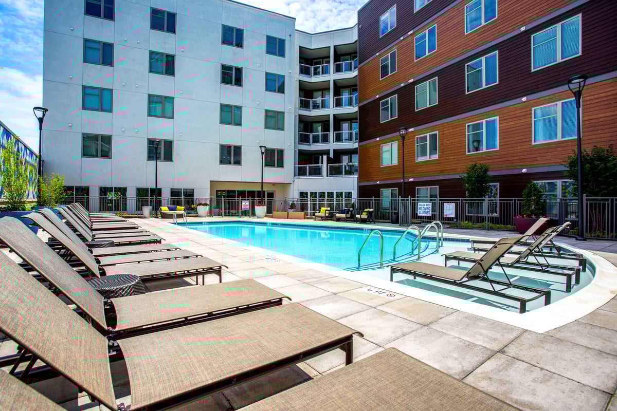 Pool area with lounge chairs.