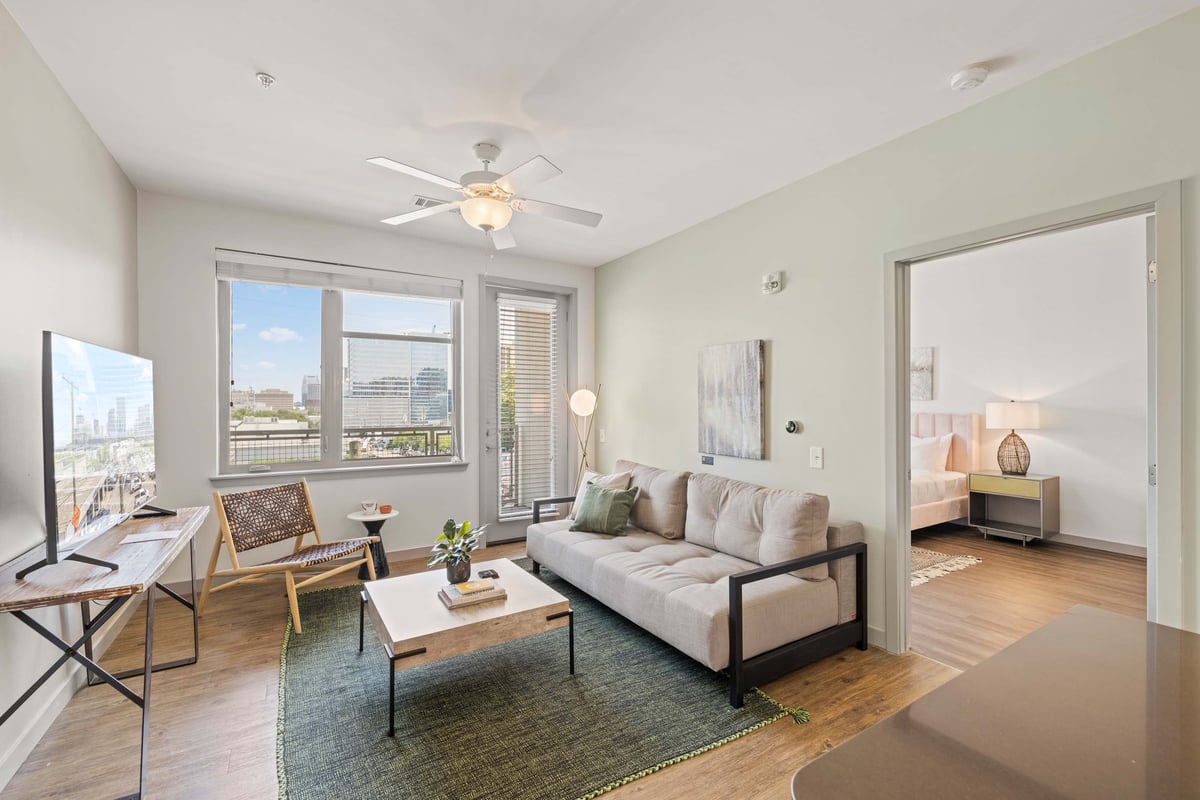 Modern, spacious living area with balcony.