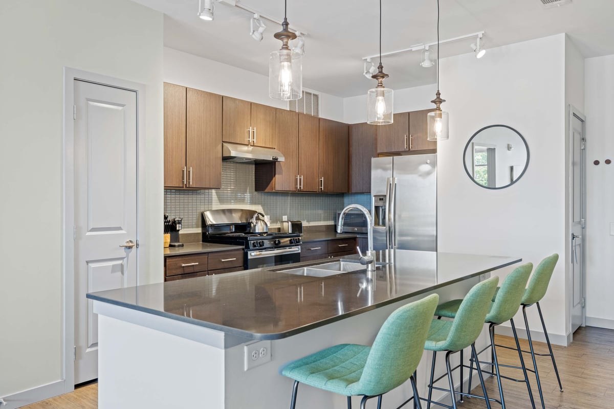 Full, modern kitchen with island seating.