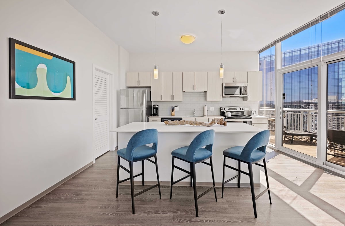 Kitchen with island and barstools. 