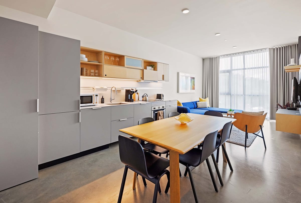 Dining space with full kitchen. 