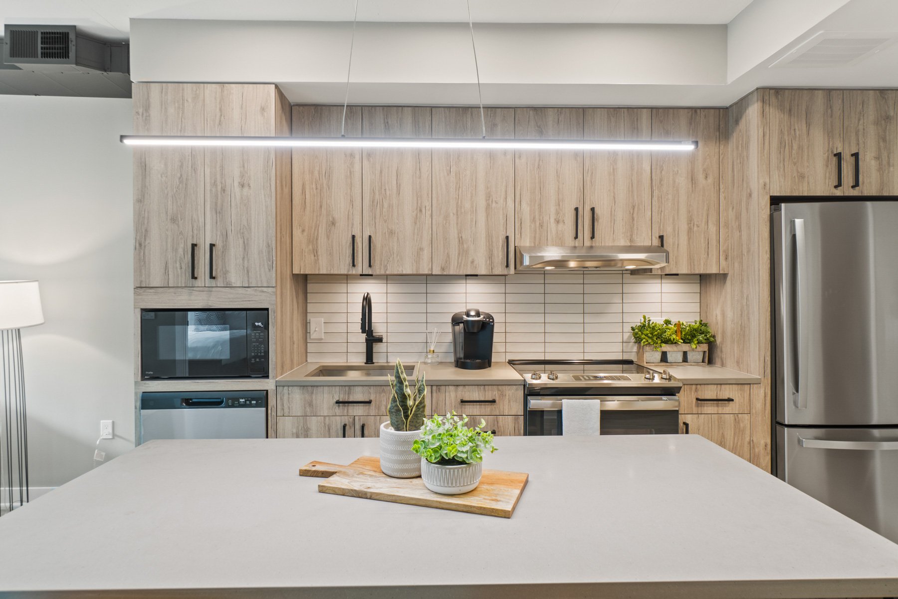 Sleek kitchen with stainless steel appliances.