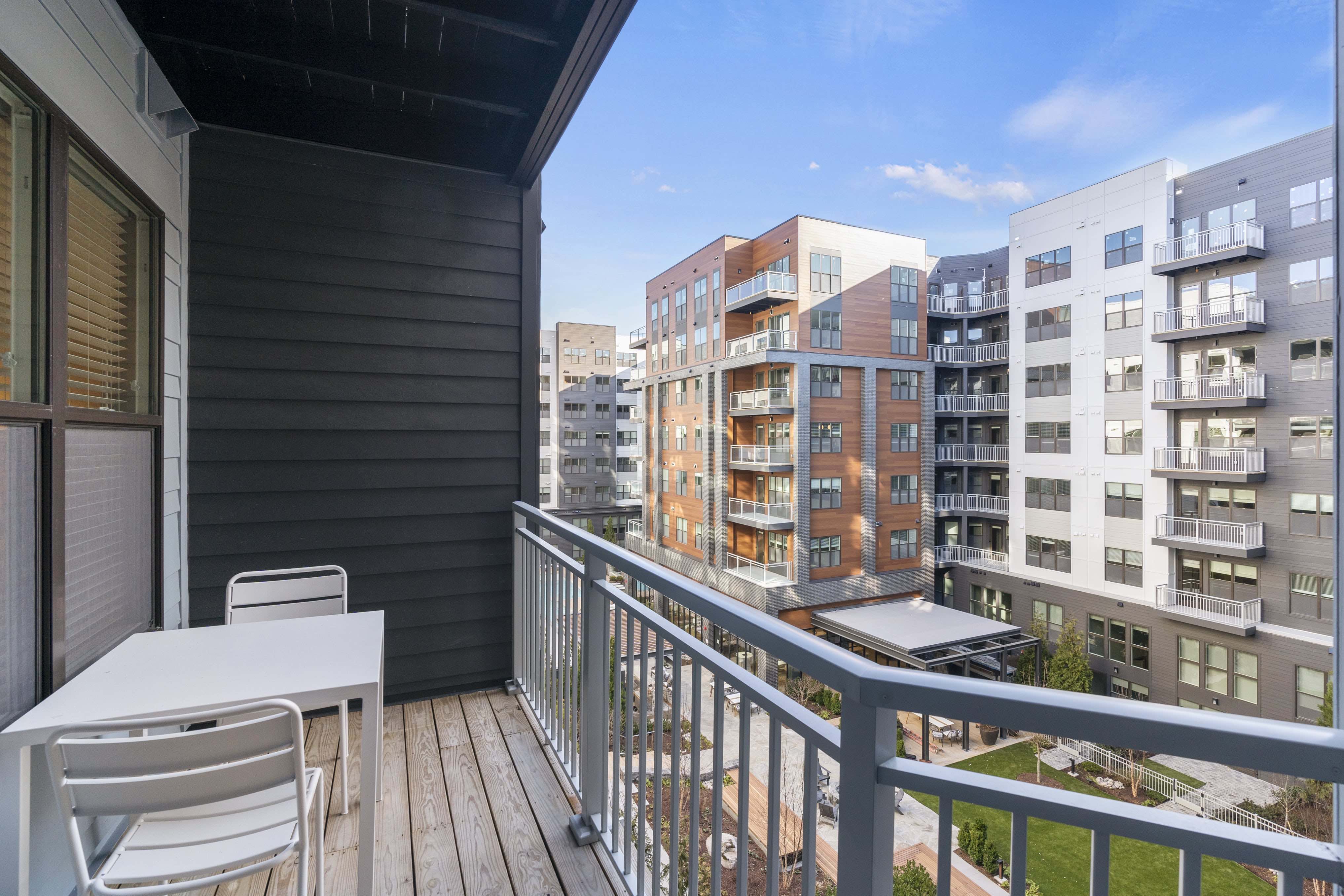 Balcony with outdoor seating. 