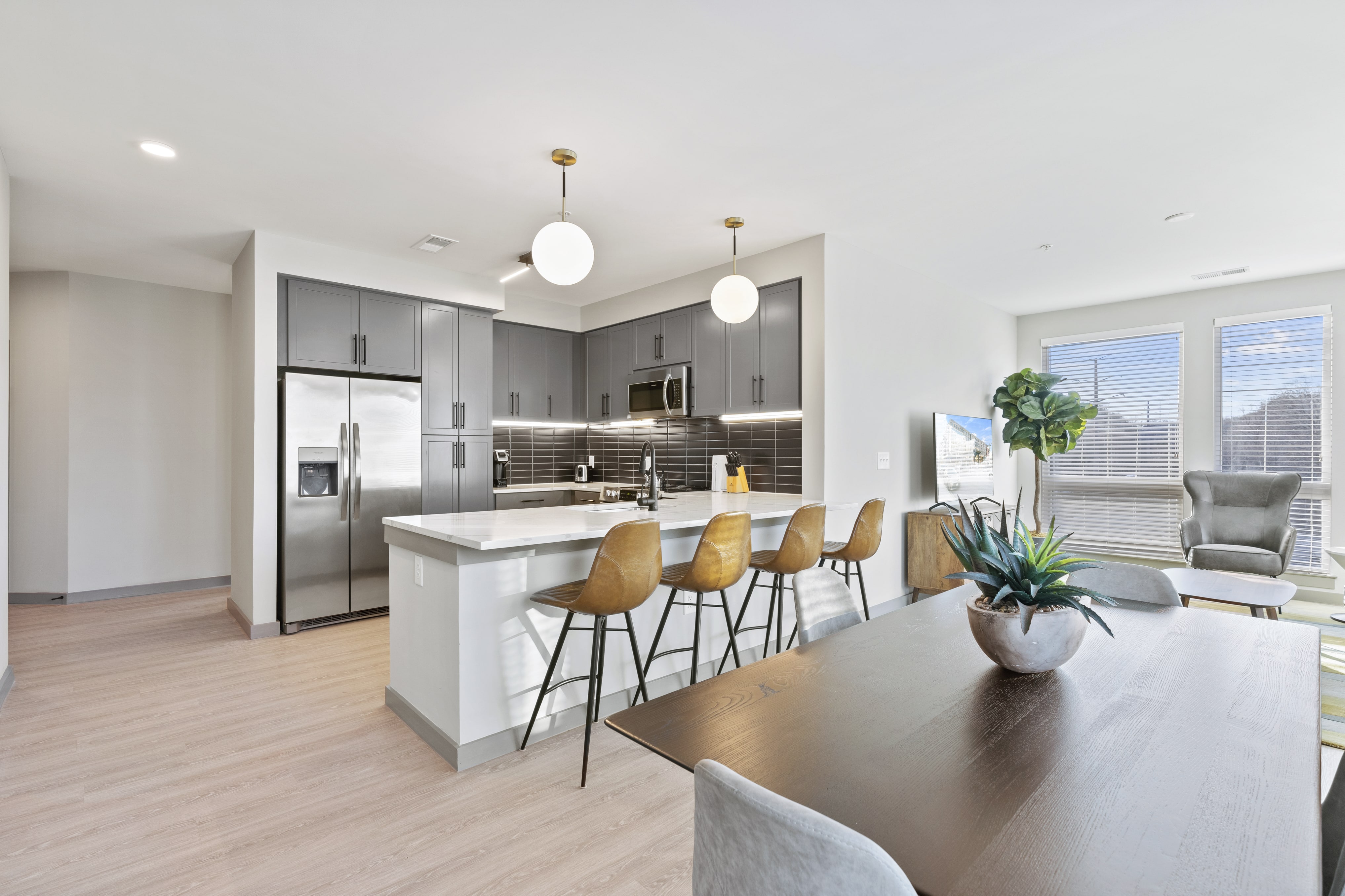 Full kitchen with breakfast bar and dining area. 