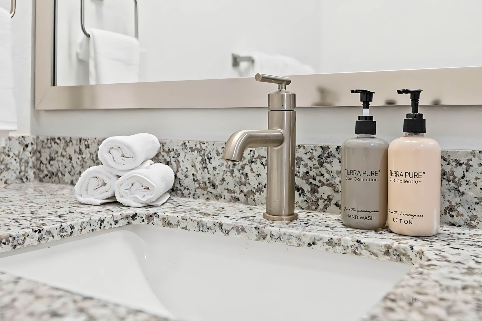 AUTX002_Guestroom_Premium Two Bedroom Apartment_Bathroom_Granite sink faucet towels