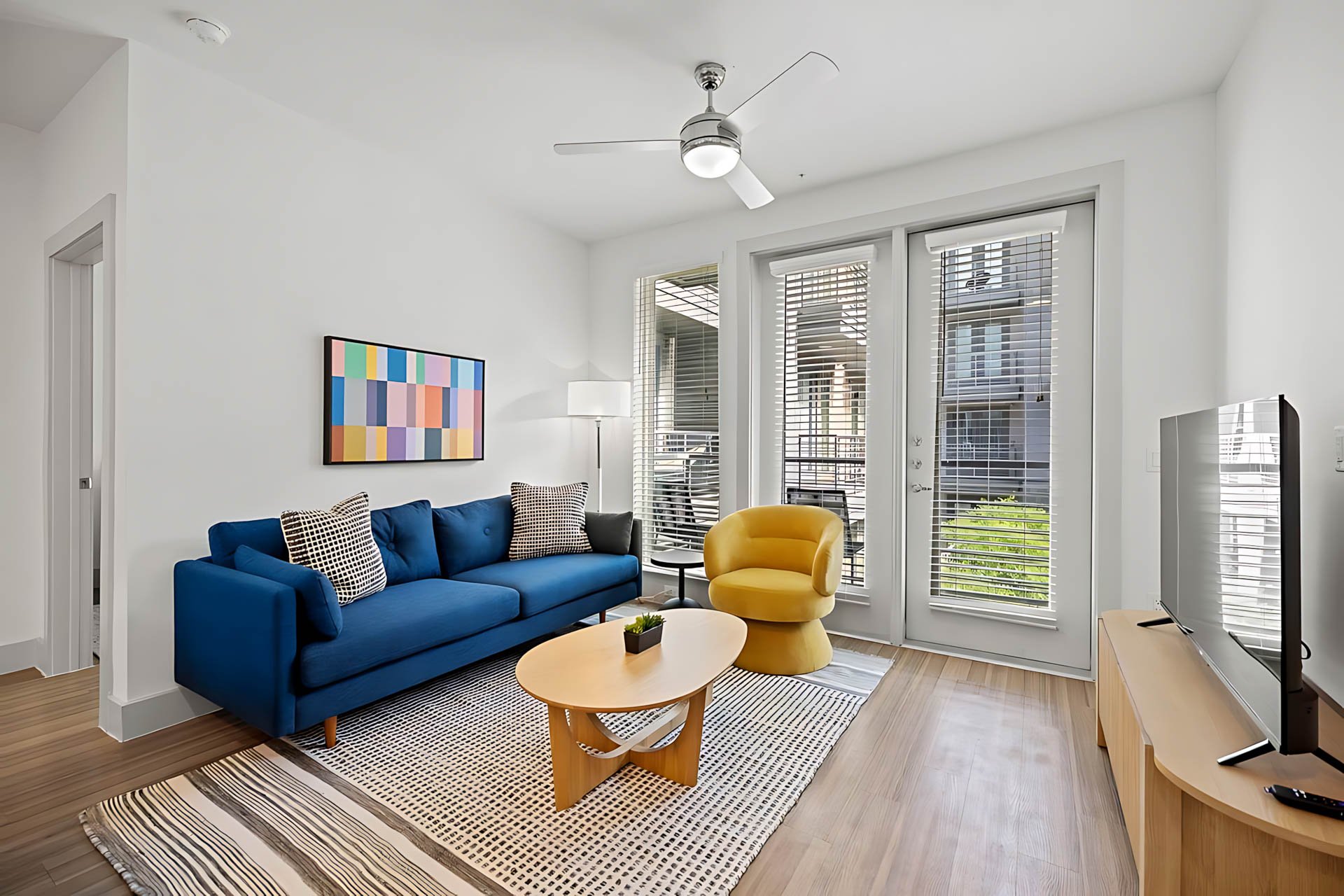 AUTX002_Guestroom_Premium Two Bedroom Apartment_Lounge Area_Colorful Art Balcony Access