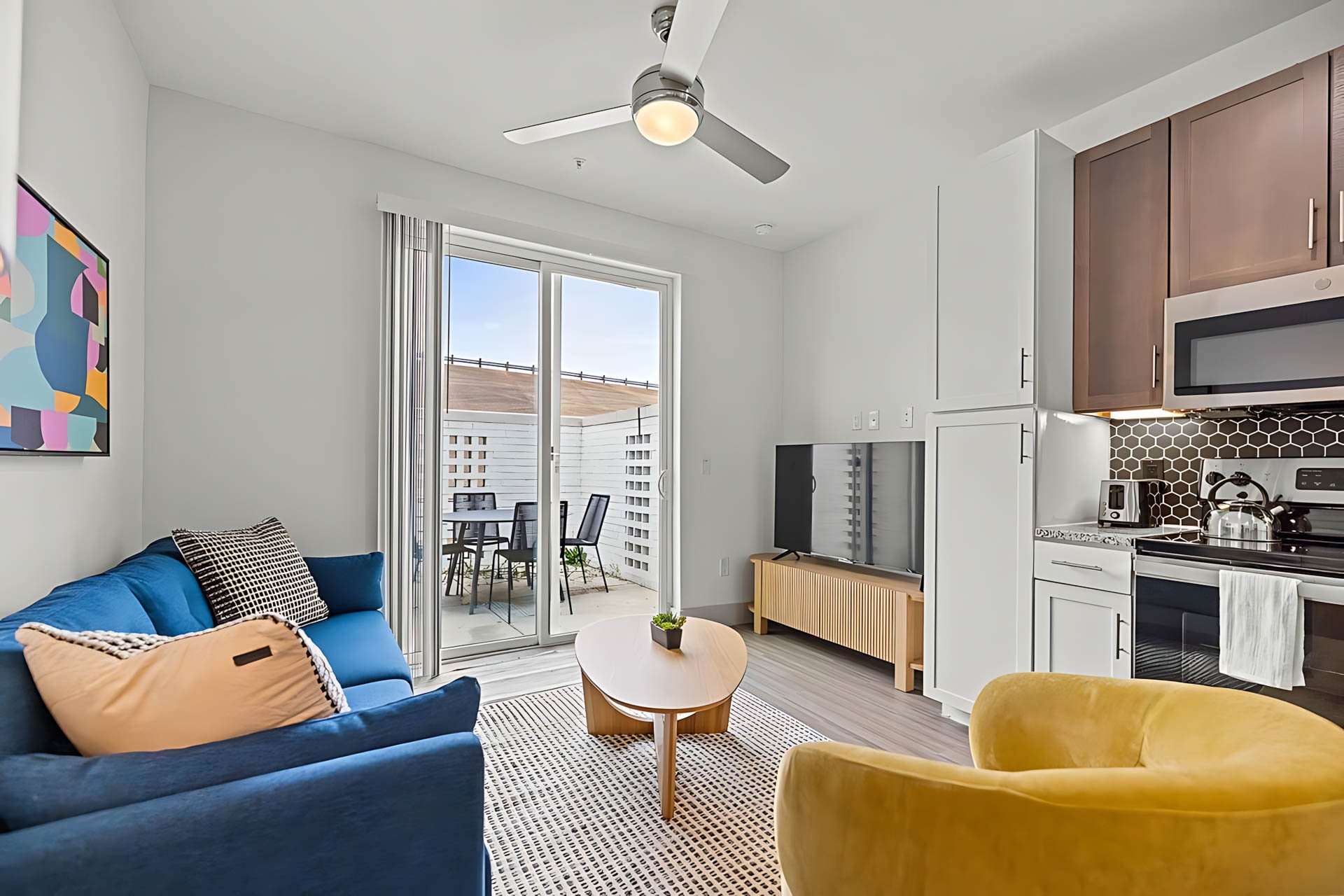 AUTX002_Guestroom_Two-story Two Bedroom Apartment_Lounge Area_Kitchen View Balcony Access