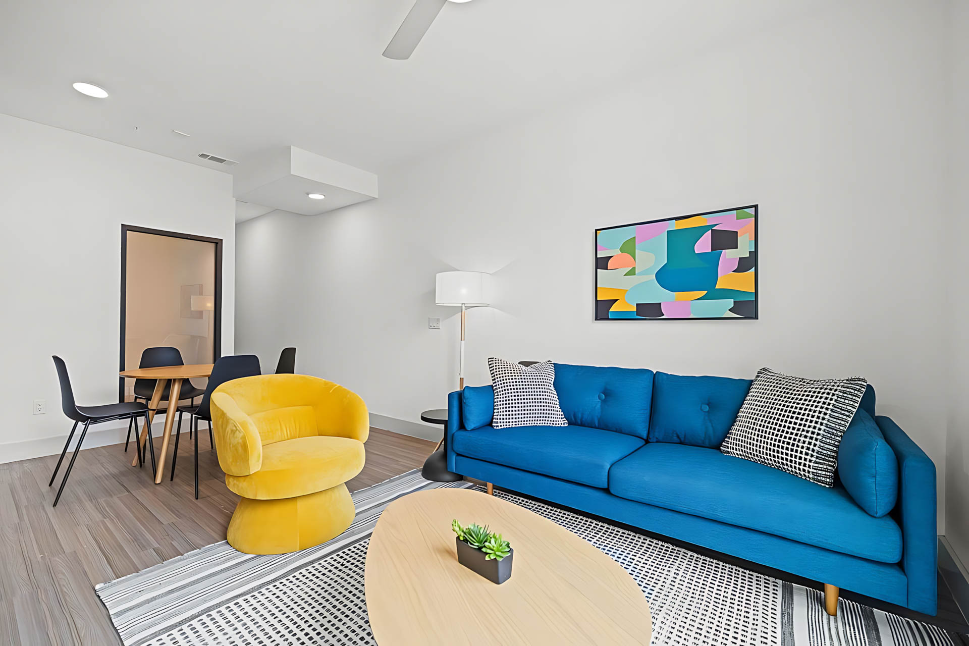 AUTX002_Guestroom_Two-story Two Bedroom Apartment_Lounge Area_Yellow Chair Colorful Wall