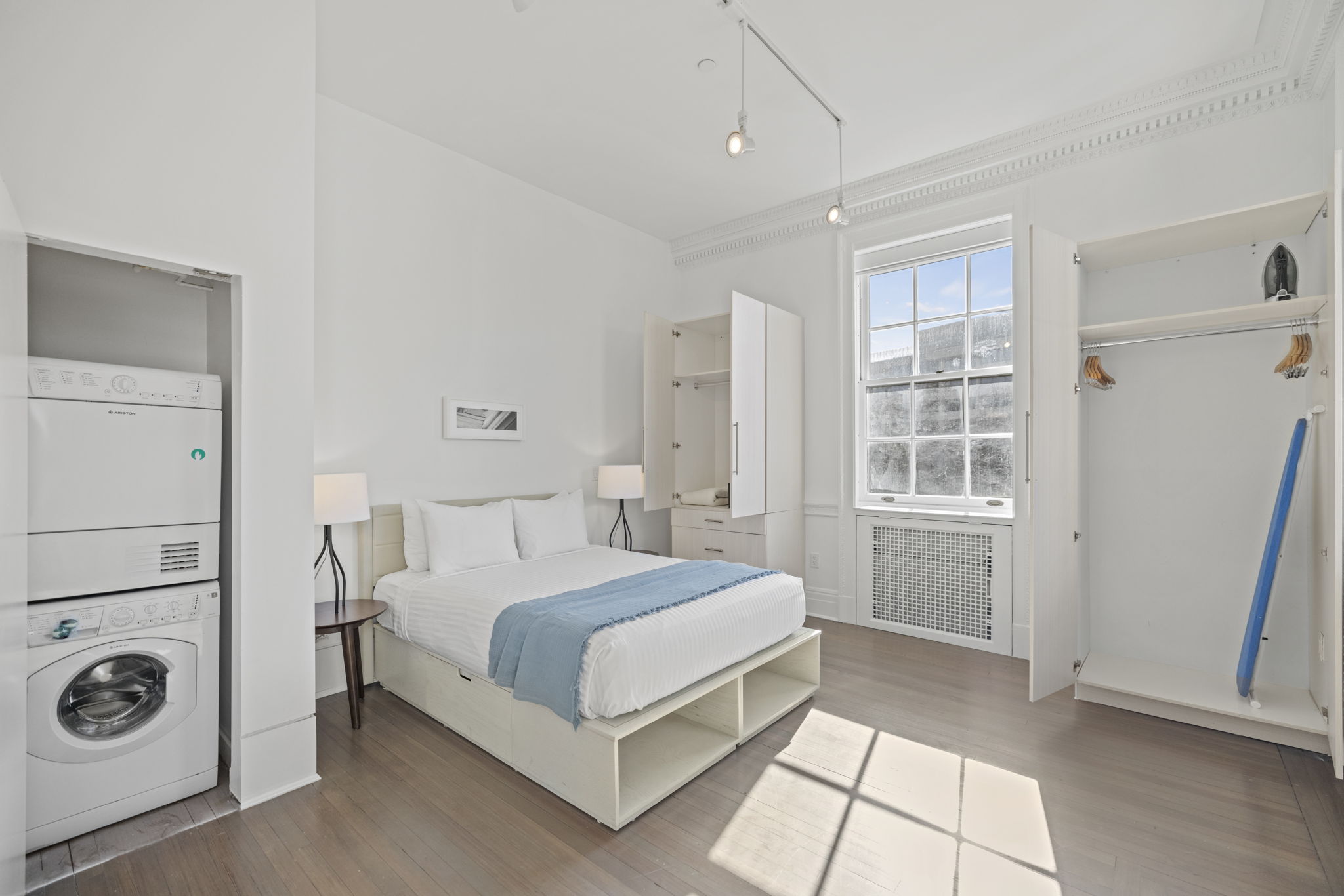 Bedroom with washer and dryer