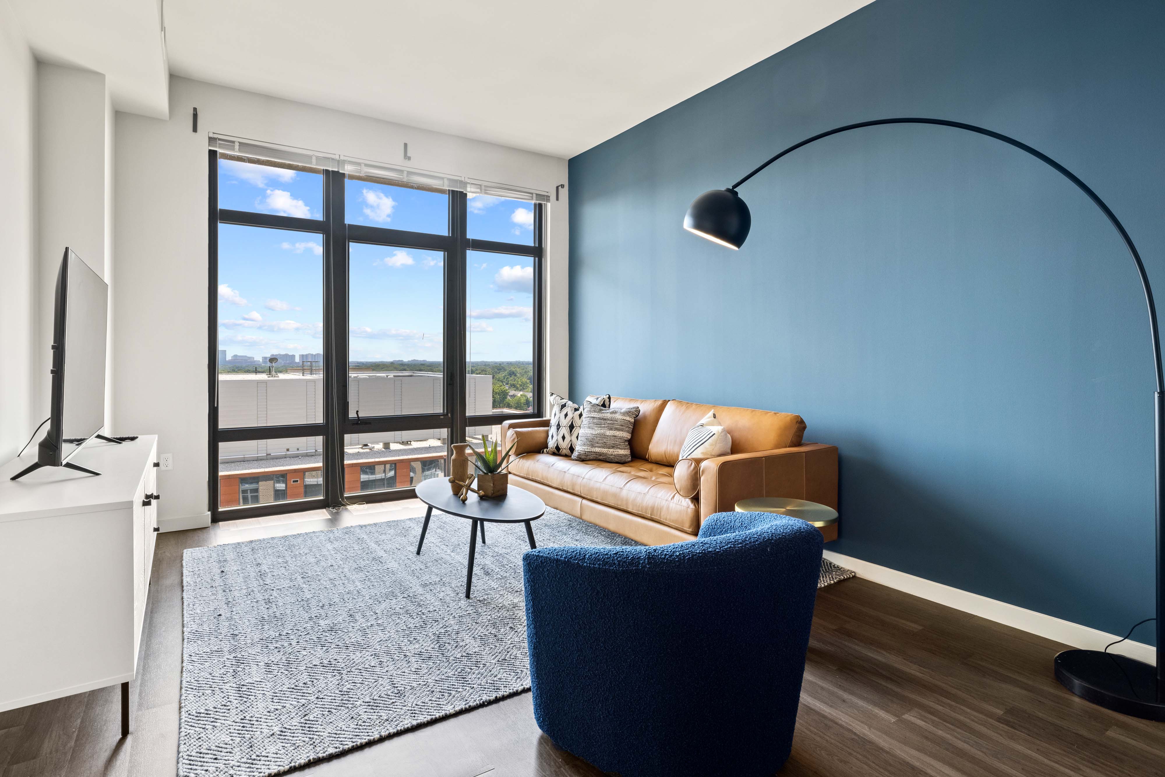 living room with floor to ceiling windows 