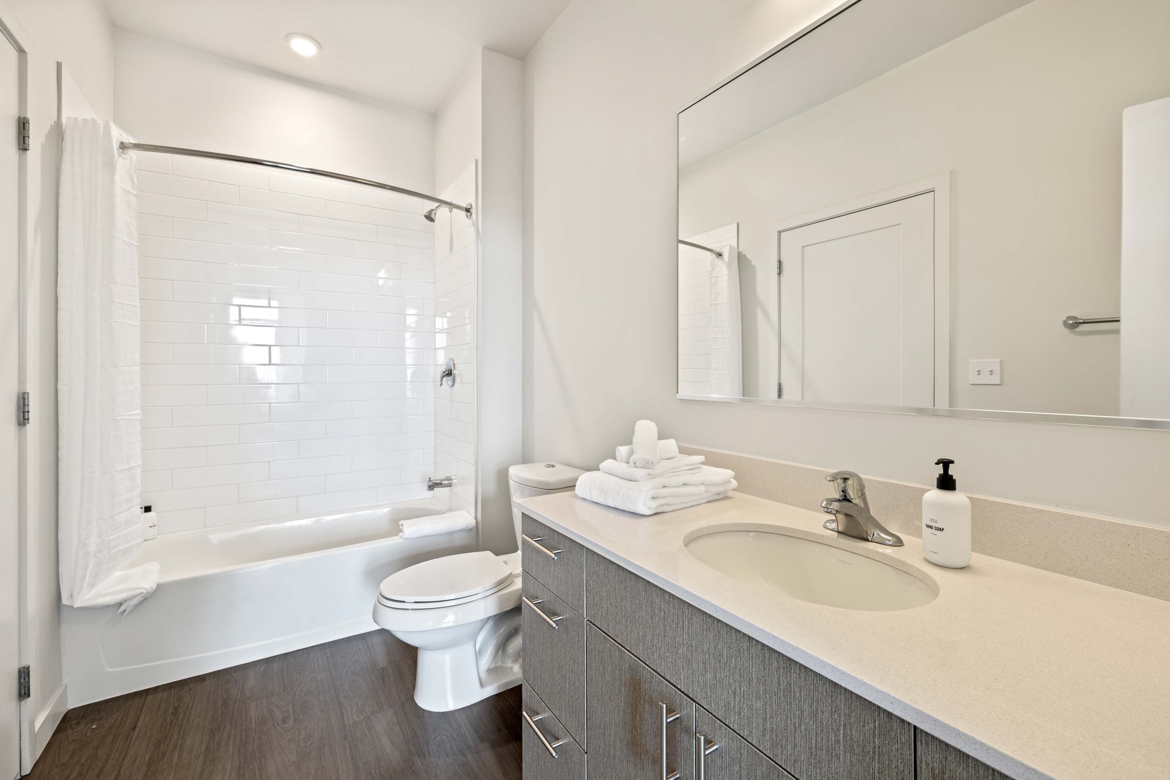 Large, modern bathroom in hotel suite