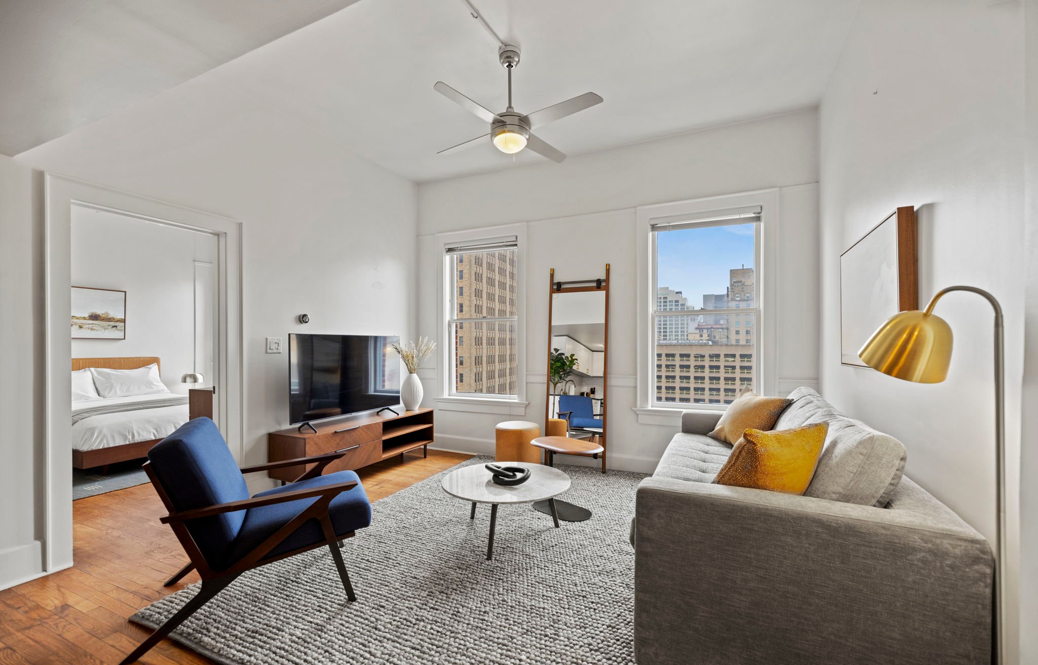 Spacious living area with television.