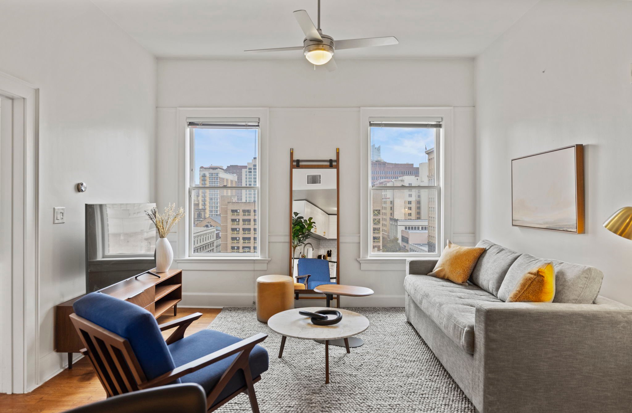 Spacious living area with television.