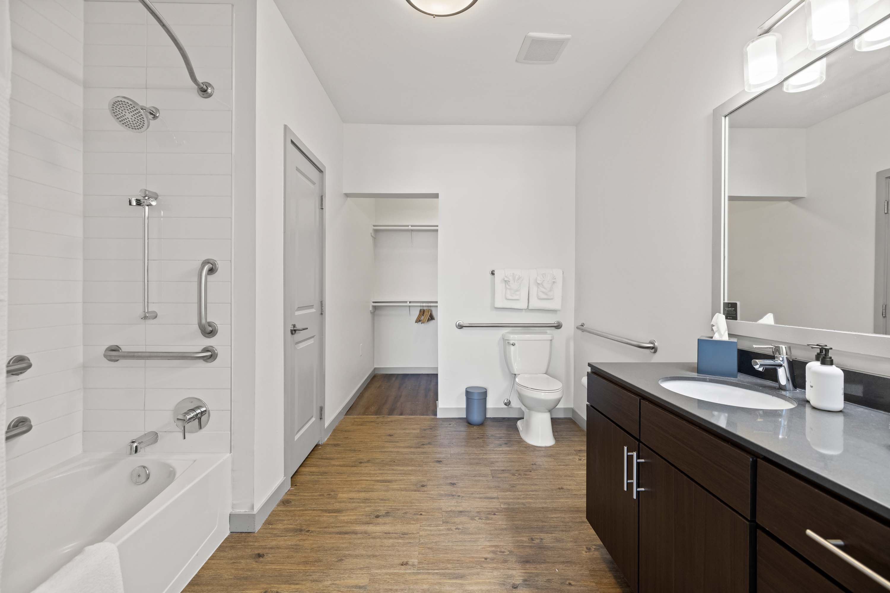 Spacious bathroom with combination bath and shower.