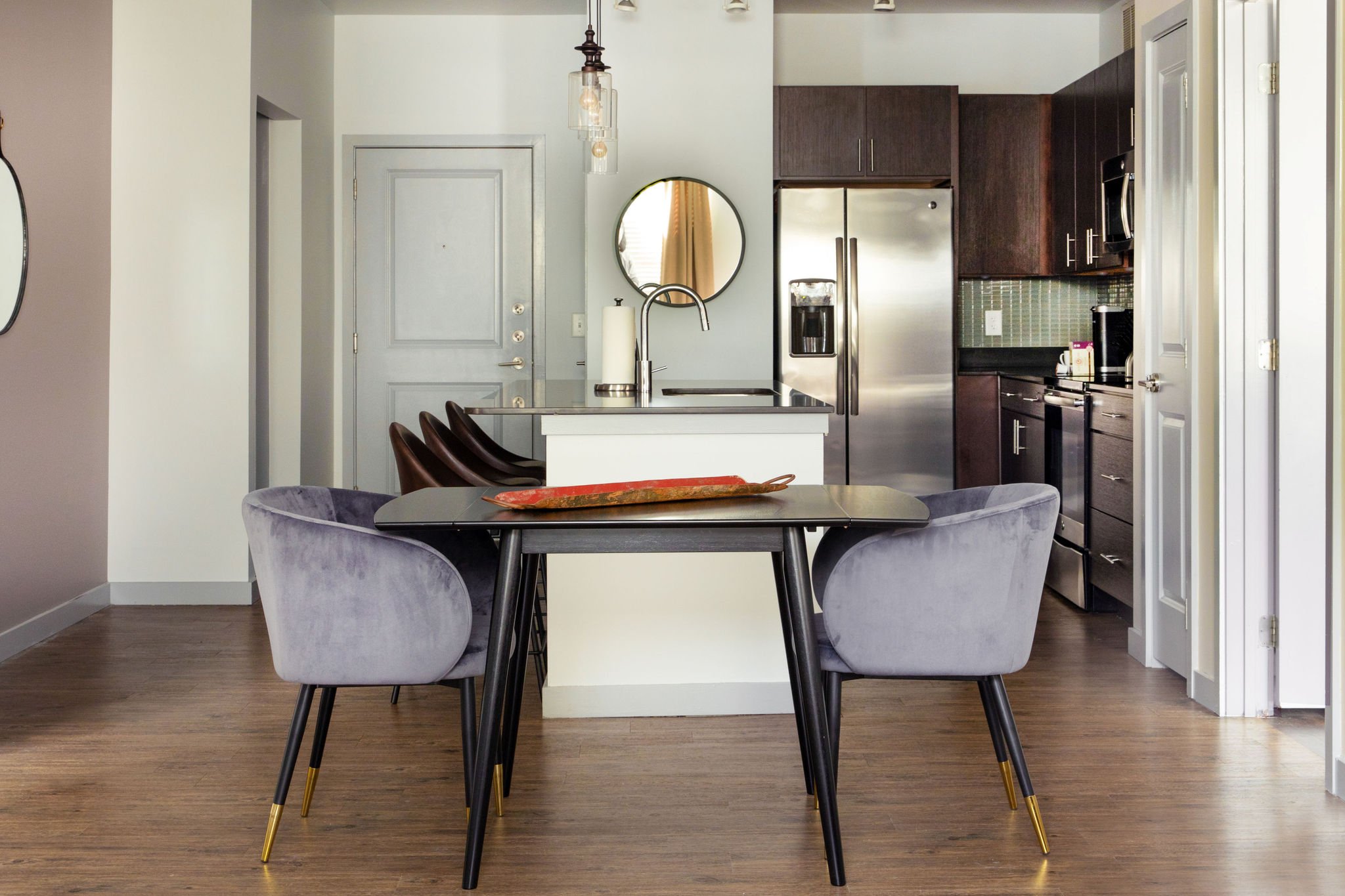 Dining area with full kitchen.