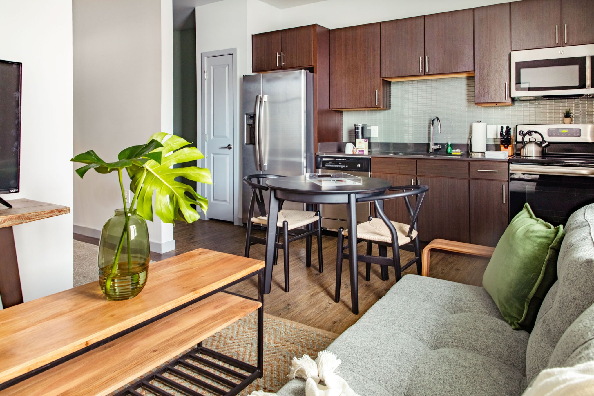 Living and dining areas with kitchen.