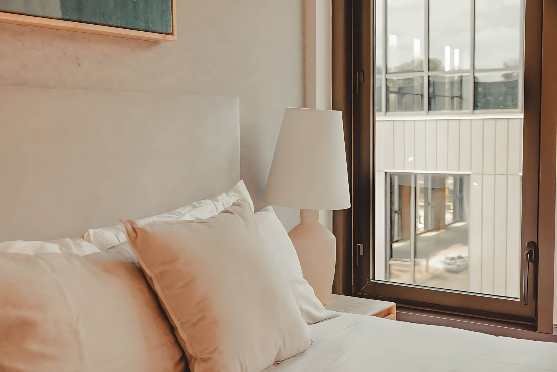 ATGA001_Guestroom_Premium Two Bedroom_Bed_Beige pillows lamp window