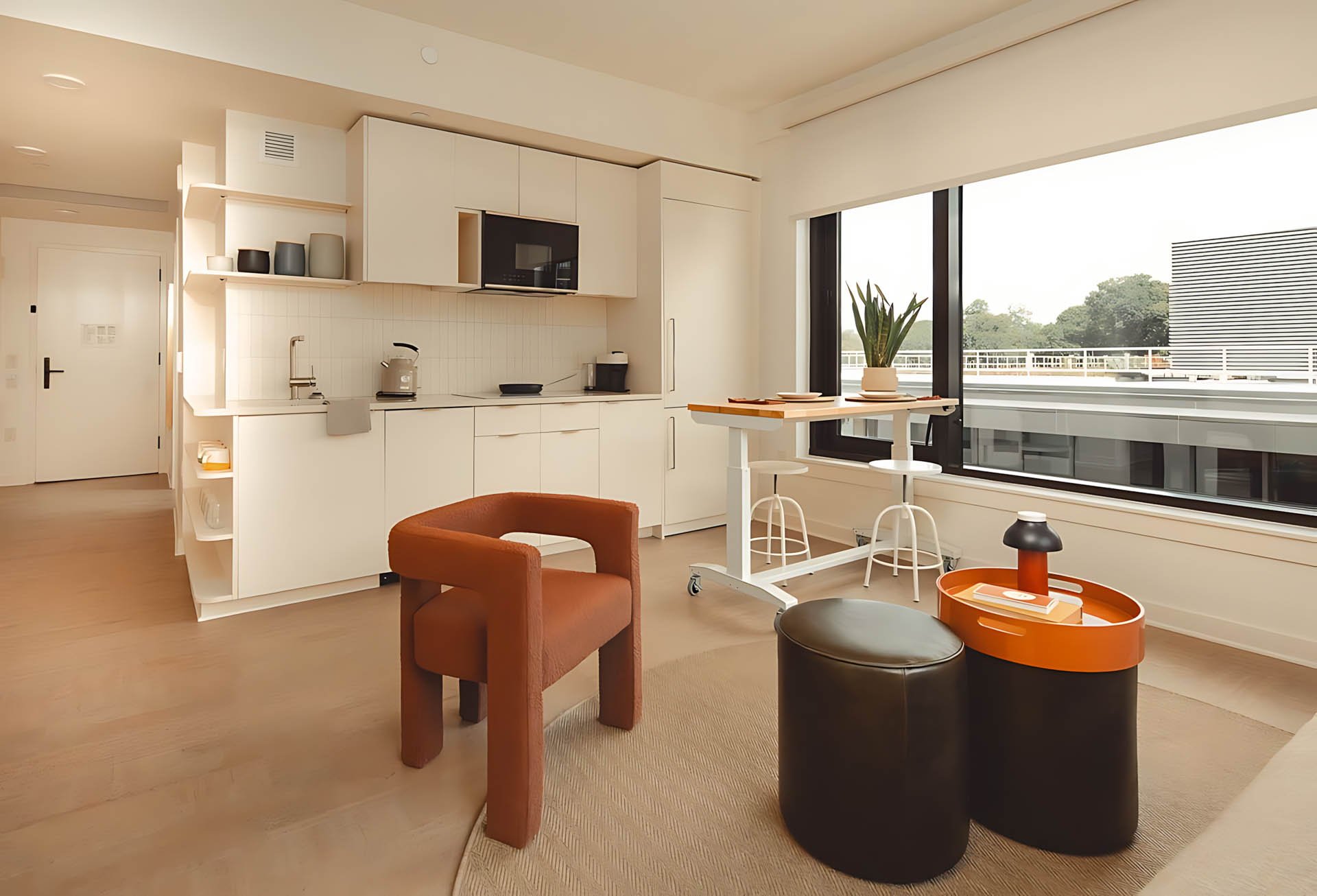 ATGA001_Guestroom_Premium Two Bedroom_Kitchen_White kitchen brown chair