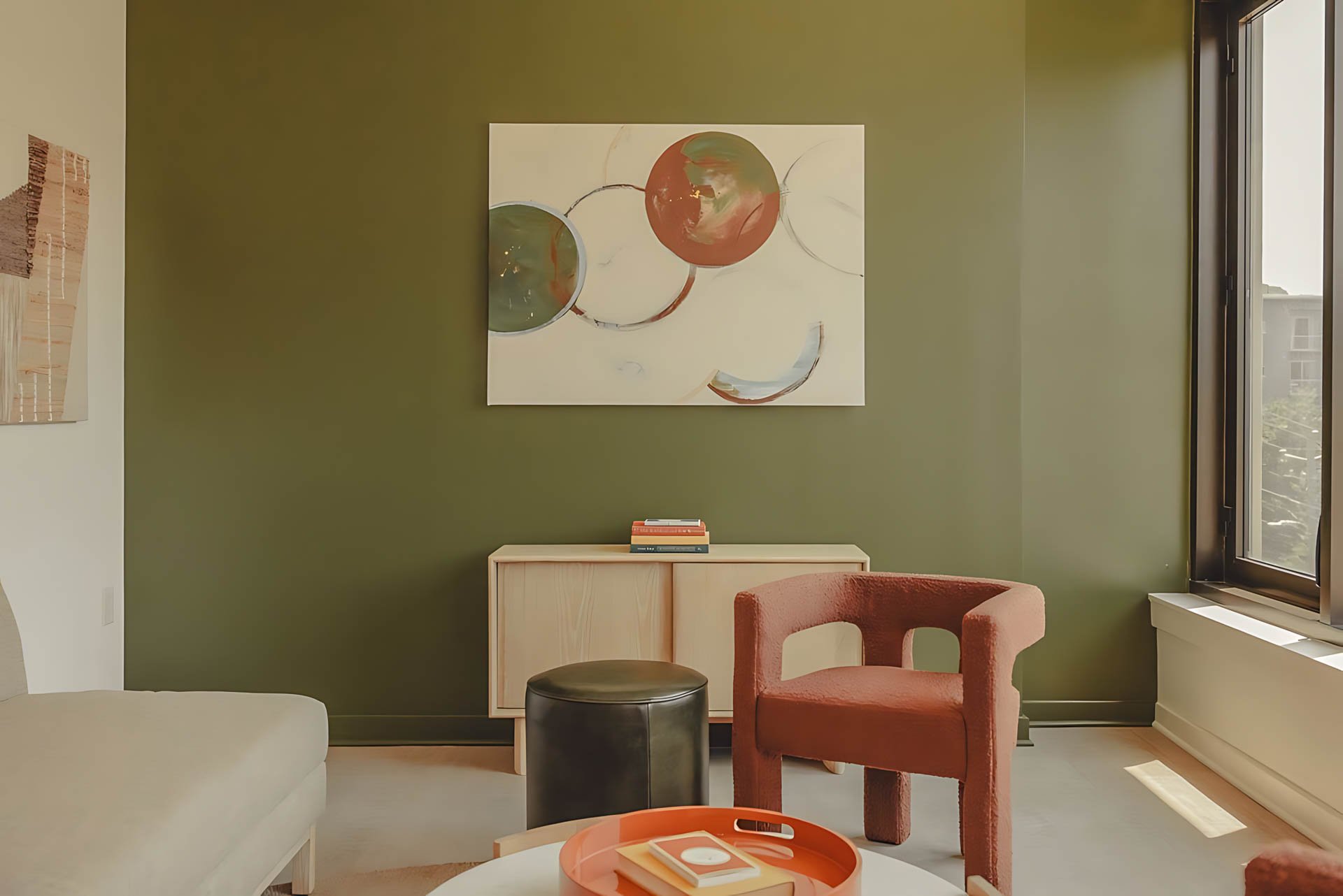 ATGA001_Guestroom_Premium Two Bedroom_Lounge Area_Red armchair black ottoman