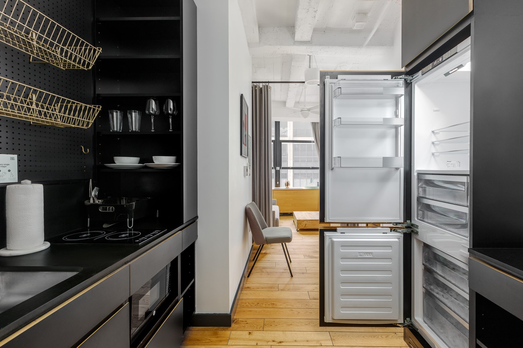 Kitchenette with fridge.