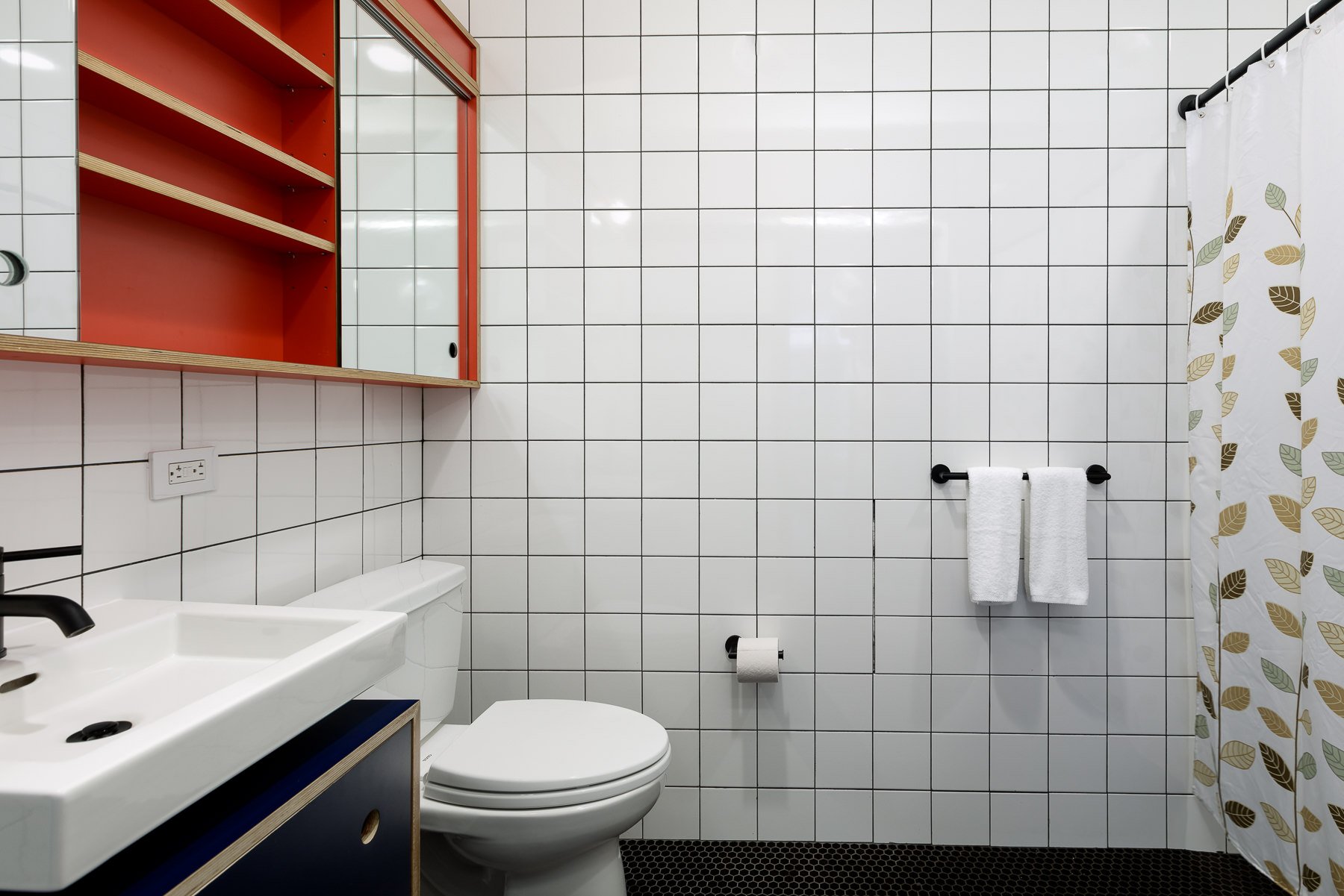 Bathroom with walk-in shower.