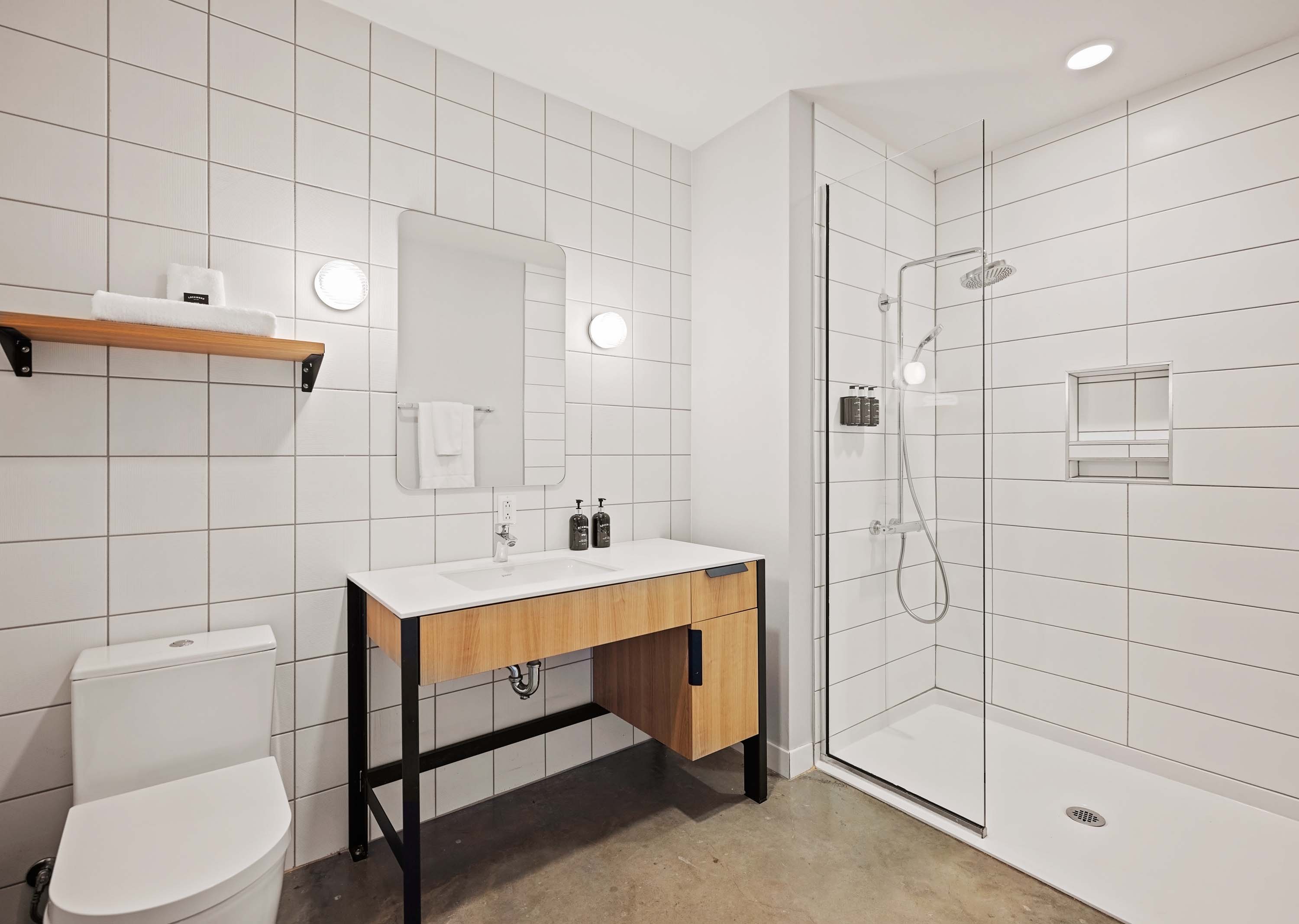 Large modern bathroom with walk-in shower. 