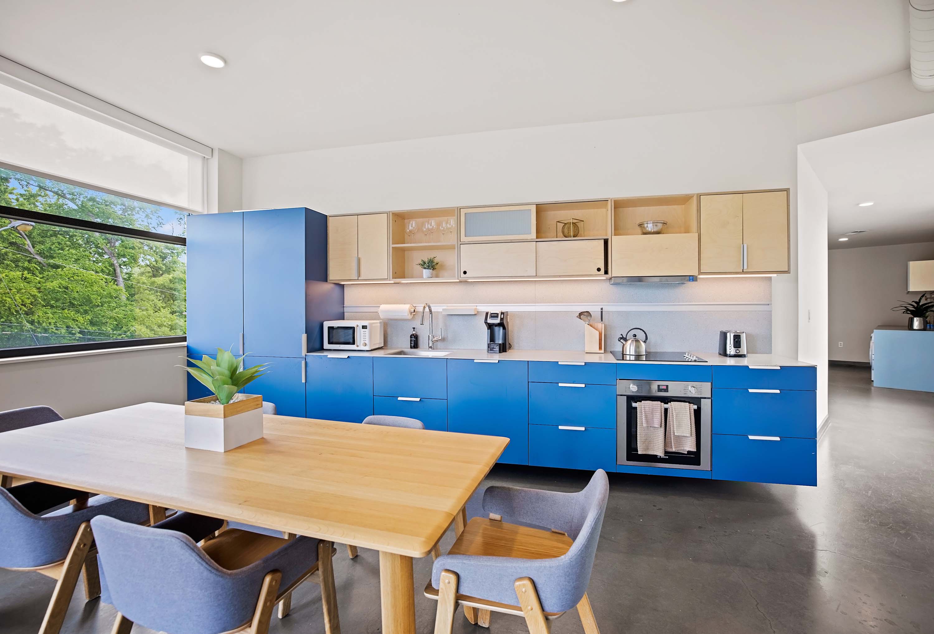 Large communal kitchen with dining area. 