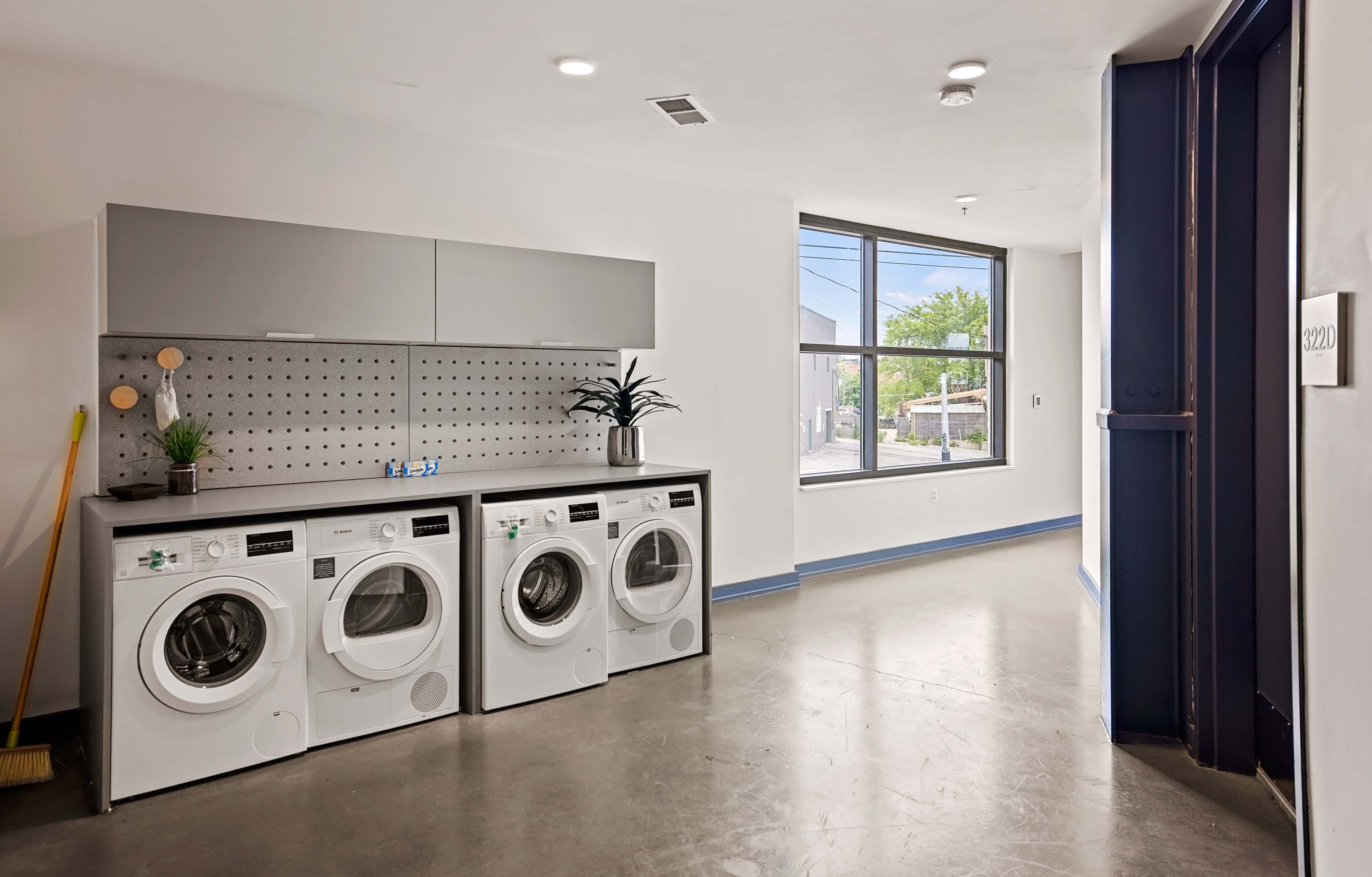 Laundry facilities with washers and dryers. 